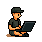 Cory sitting down using a Lenovo X200 laptop